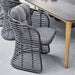 Boxhill's Basket Outdoor Dining Chair Graphite lifestyle image beside Aspect dining table