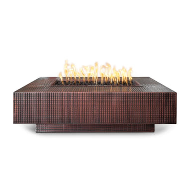 Dark brown hammered copper outdoor metal fire pits with lava rocks and flame on top