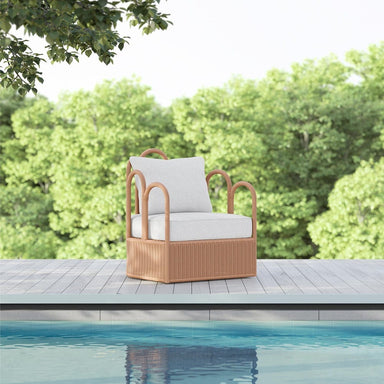 Capris Swivel Outdoor Club Chair in pool side area