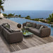 Boxhill's Glaze Outdoor Rectangular Coffee Table lifestyle image with module sofa on wooden platform poolside