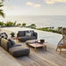 Boxhill's Capture Outdoor Pouf lifestyle image with Capture Module Sofa and Capture Coffee Table beside the pool