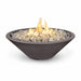 Dark grey outdoor tapered shaped round fire pit filled with lava rocks with flames on top