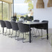 Boxhill's Choice Outdoor Dining Chair Warm Galvanized Steel Sledge Base lifestyle image with Pure Dining Table