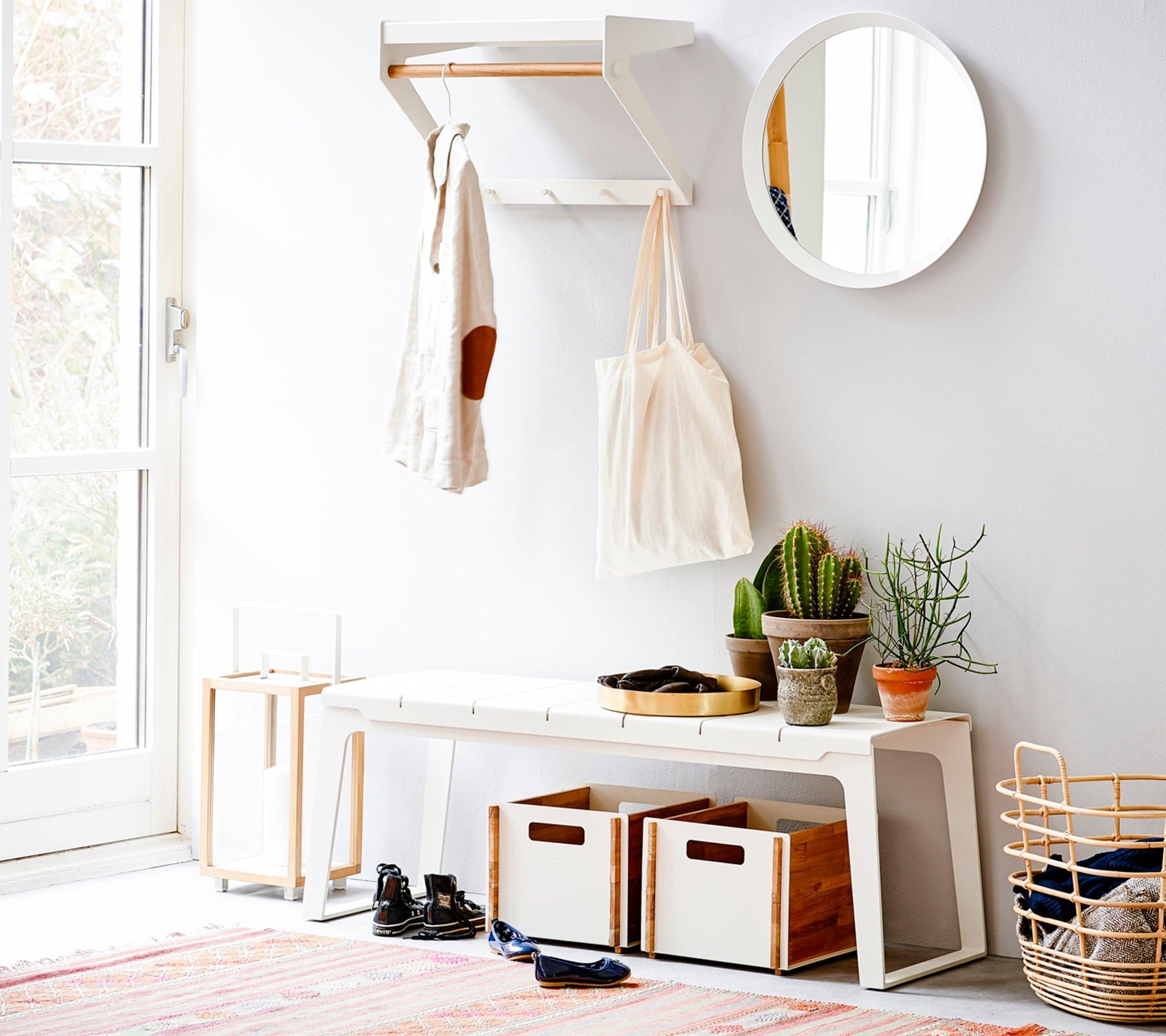 Boxhill's Copenhagen City Rack Teak/White lifestyle image with fabric bag and a white clothes hanging