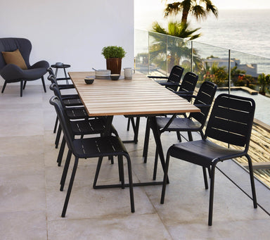 Boxhill's Copenhagen Dining Chair (Set of 2) Lava Grey lifestyle image with Copanhagen  Coastal Dining Table on balcony