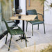 Boxhill's Copenhagen Dining Armchair (Set of 2) Dark Green lifestyle image with wooden square table at patio