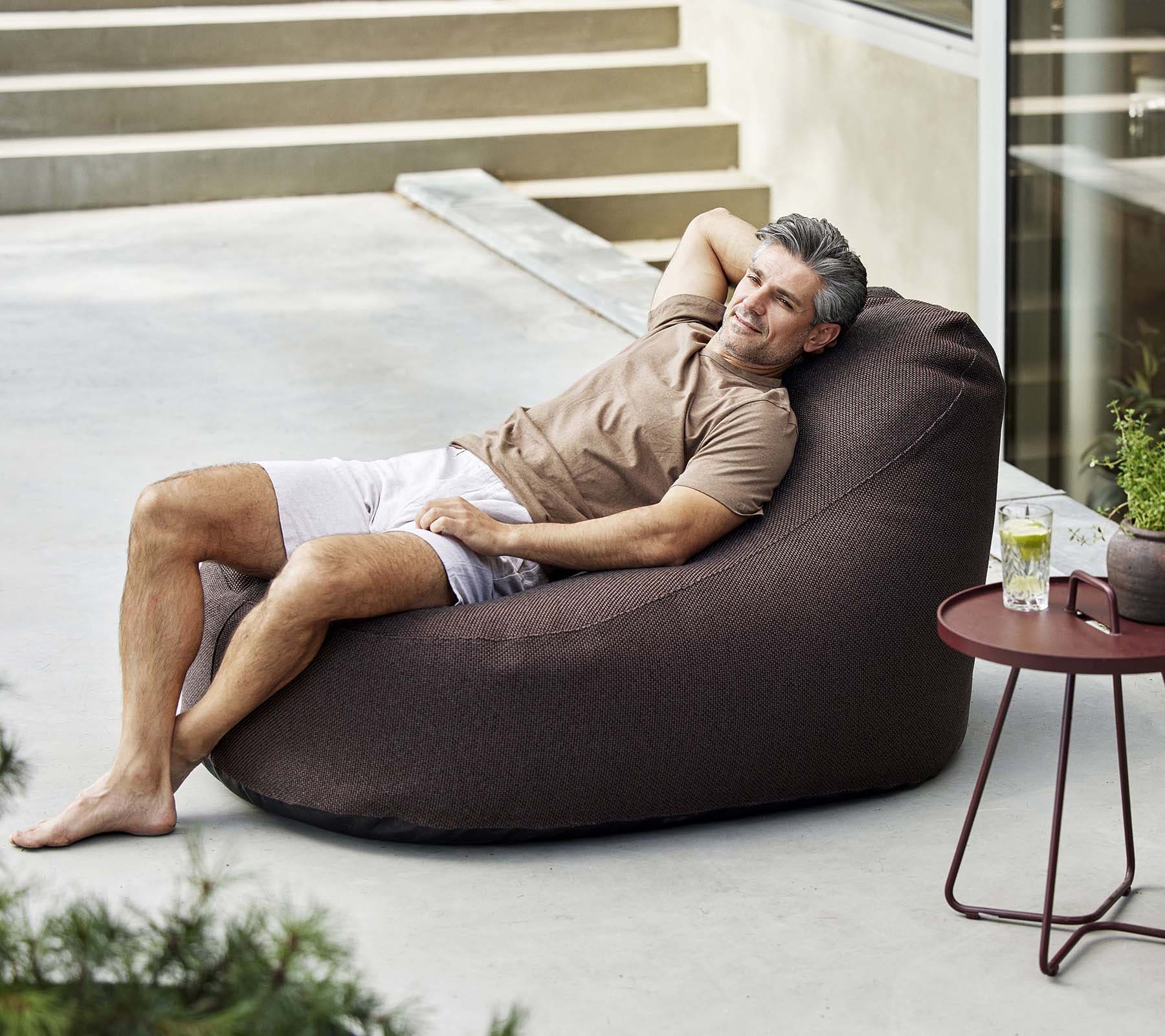 Boxhill's Cozy Outdoor Bean Bag Chair Dark Bordeaux lifestyle image with a man lying down