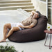 Boxhill's Cozy Outdoor Bean Bag Chair Dark Bordeaux lifestyle image with a man lying down