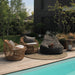 Boxhill's Cozy Outdoor Bean Bag Chair Dark Grey lifestyle image with a dog on top and 2 club chairs beside the pool