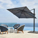 Boxhill's Hyde Luxe Tilt Aluminum Parasol | 3x3 m lifestyle image with 4 lounge chairs at poolside