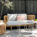 Boxhill's Nest 2-Seater Sofa lifestyle image with Nest Round Rattan Chair and 2 small round table at patio
