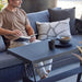 Boxhill's Chill-Out Coffee Table, Dual Heights Black lifestyle image with a man sitting down