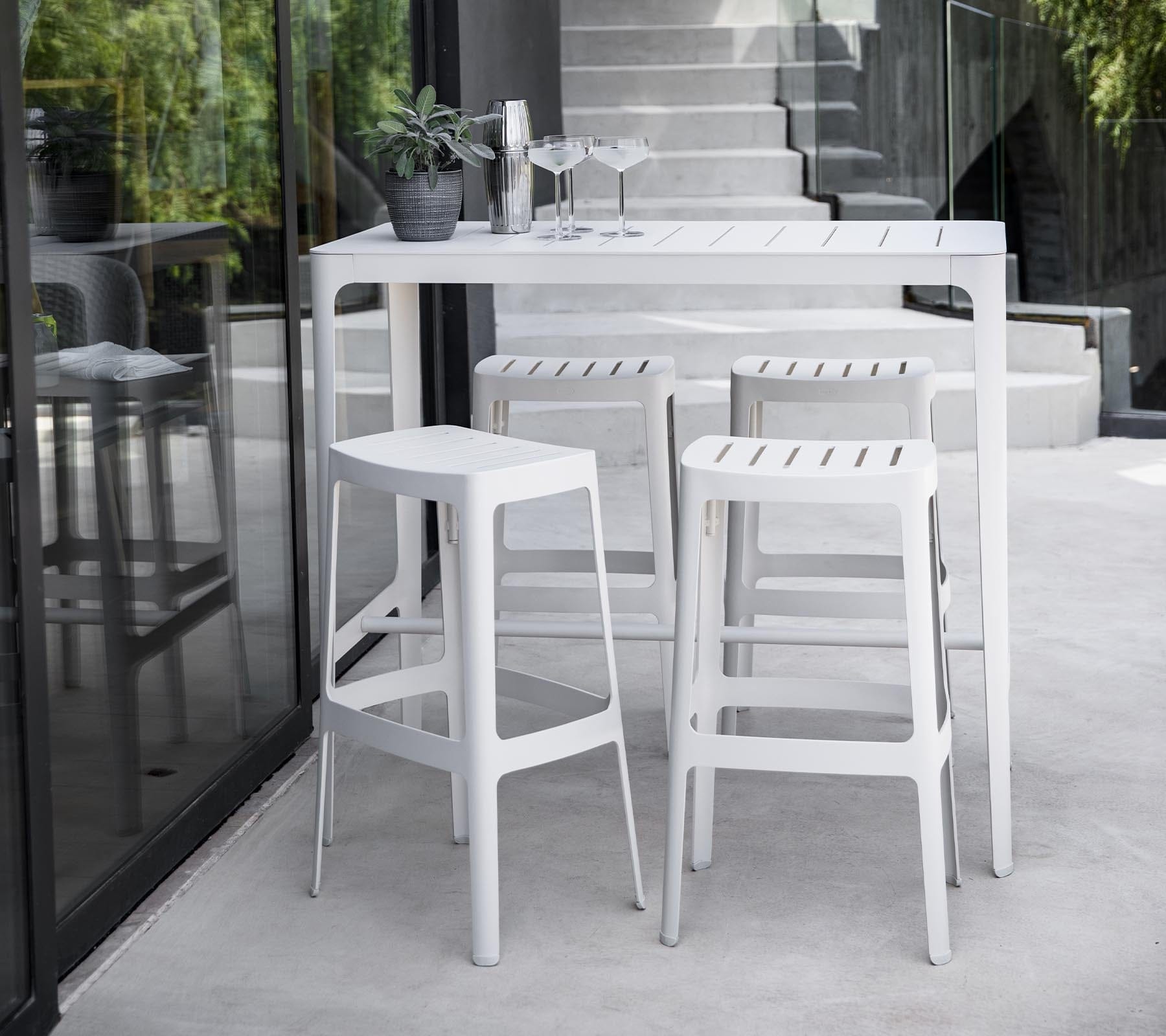 Boxhill's Cut High Outdoor Bar Table White lifestyle image with Cut High Outdoor Bar Chair at patio