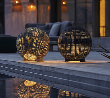 Boxhill's Illusion Outdoor Lamp | Round lifestyle image at poolside