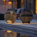Boxhill's Illusion Outdoor Lamp | Round lifestyle image at poolside