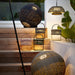 Boxhill's Illusion Outdoor Lamp | Round lifestyle image with Illusion Outdoor Hanging Lamp w/ Stand and Led Lamp and Illusion Outdoor Lamp | With Handle at the stairs