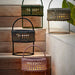 Boxhill's Illusion Outdoor Lamp | With Handlle lifestyle image on the stairs with 4 different colors 