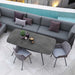 Boxhill's Joy Rectangular Outdoor Dining Table lifestyle image with module sofa and 2 dining chairs beside the pool