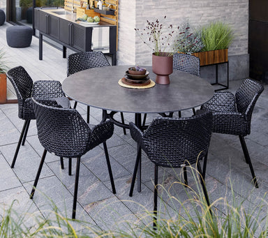 Boxhill's Joy Round Outdoor Dining Table Lifestyle image with 6 dining chairs at patio