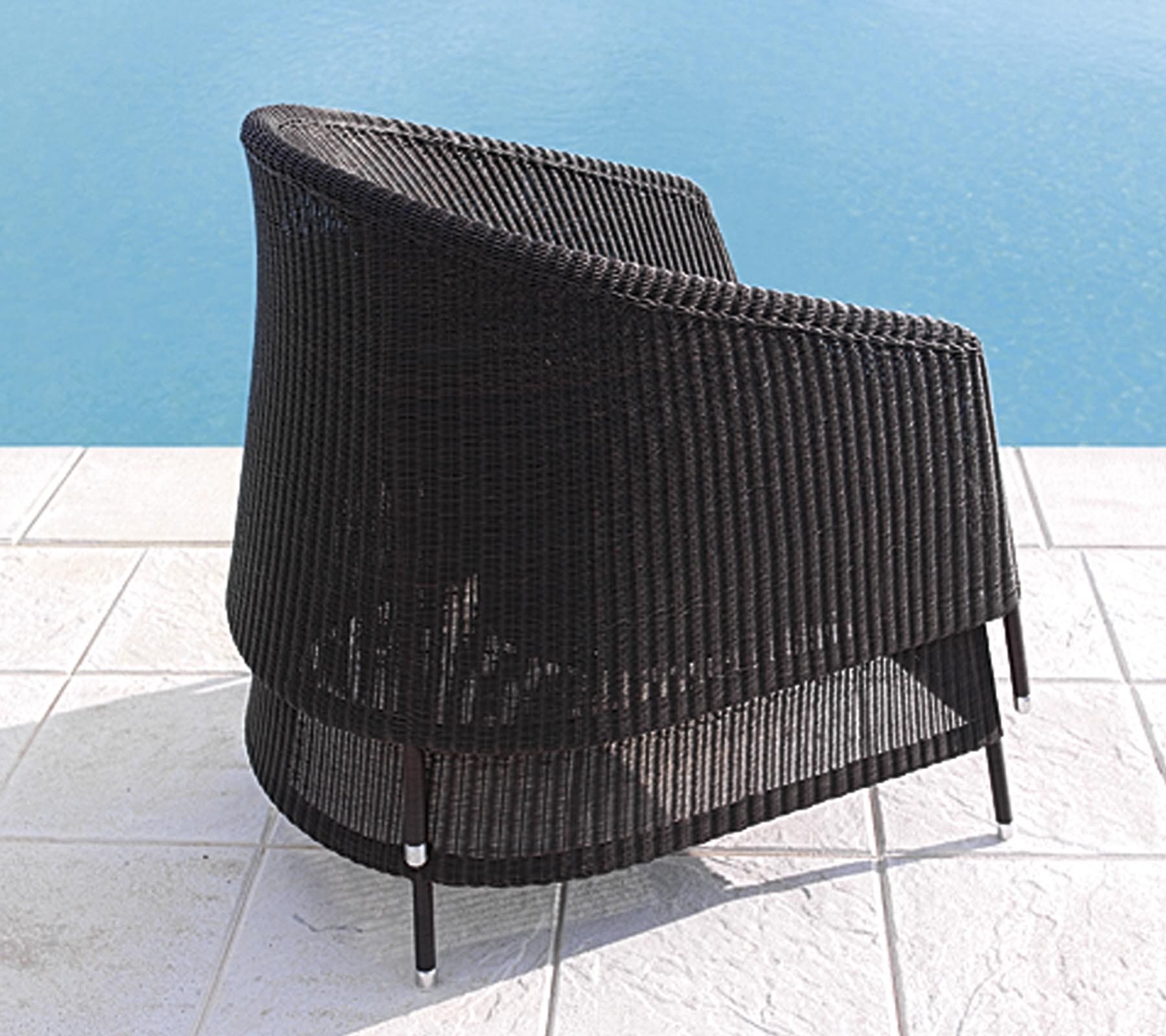 Boxhill's Kingston Outdoor Stackable Lounge Chair lifestyle image piled up at poolside