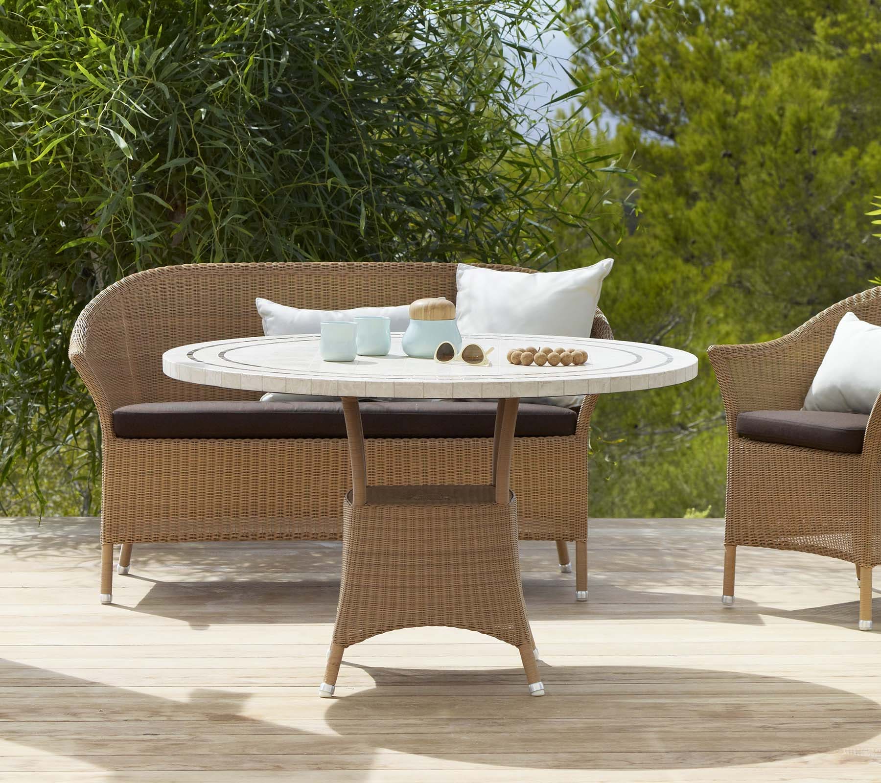 Boxhill's Lansing Outdoor 2-Seater Sofa Natural lifestyle image with Lansing Outdoor Lounge Chair and Lansing Outdoor Round Dining Table at patio