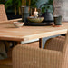 Boxhill's Lansing Outdoor Rectangular Dining Table lifestyle image with cups, pot, and candlelight on top