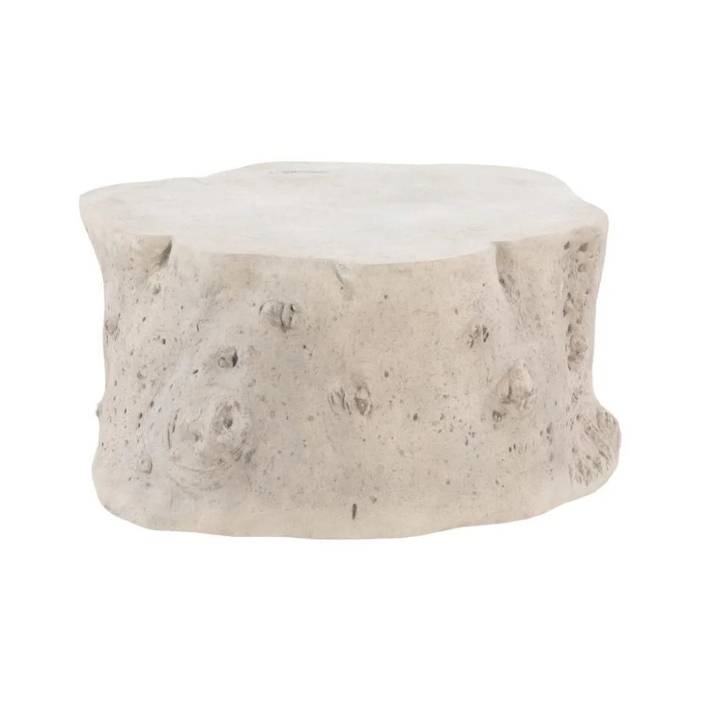 A rustic tree stump outdoor coffee table with a textured, bark-like finish in a light gray and beige stone-like finish, isolated on a white background.