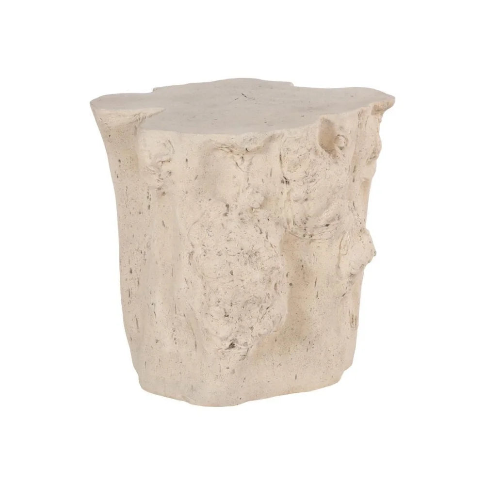Angled view of the Log Roman Outdoor Stone Side Table with a cream finish and textured, stump-shaped silhouette.