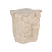Angled view of the Log Roman Outdoor Stone Side Table with a cream finish and textured, stump-shaped silhouette.