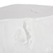 A close-up of a glossy white textured surface with a raised organic contour and small scattered droplets, against a white background.