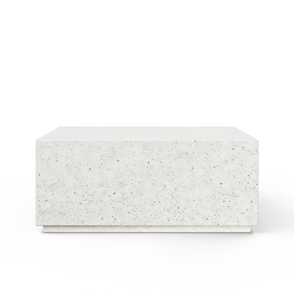 Square concrete block outdoor coffee table with a speckled pattern on a white background