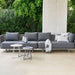 Boxhill's Moments 2-Seater Right Module Sofa lifestyle image with Moments 2-Seater Left Module Sofa and 3 round table at patio