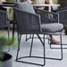 Boxhill's Moments Outdoor Dining Armchair lifestyle image at patio