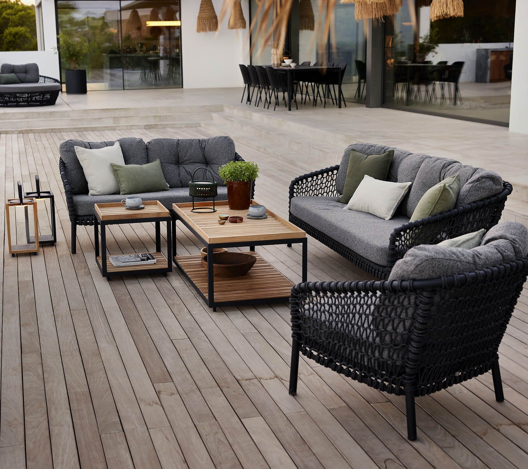 Boxhill's Ocean Large Outdoor 2-Seater Sofa lifestyle image with other Ocean Sofa and Chair Collection and Level Coffee Table with Teak Top 