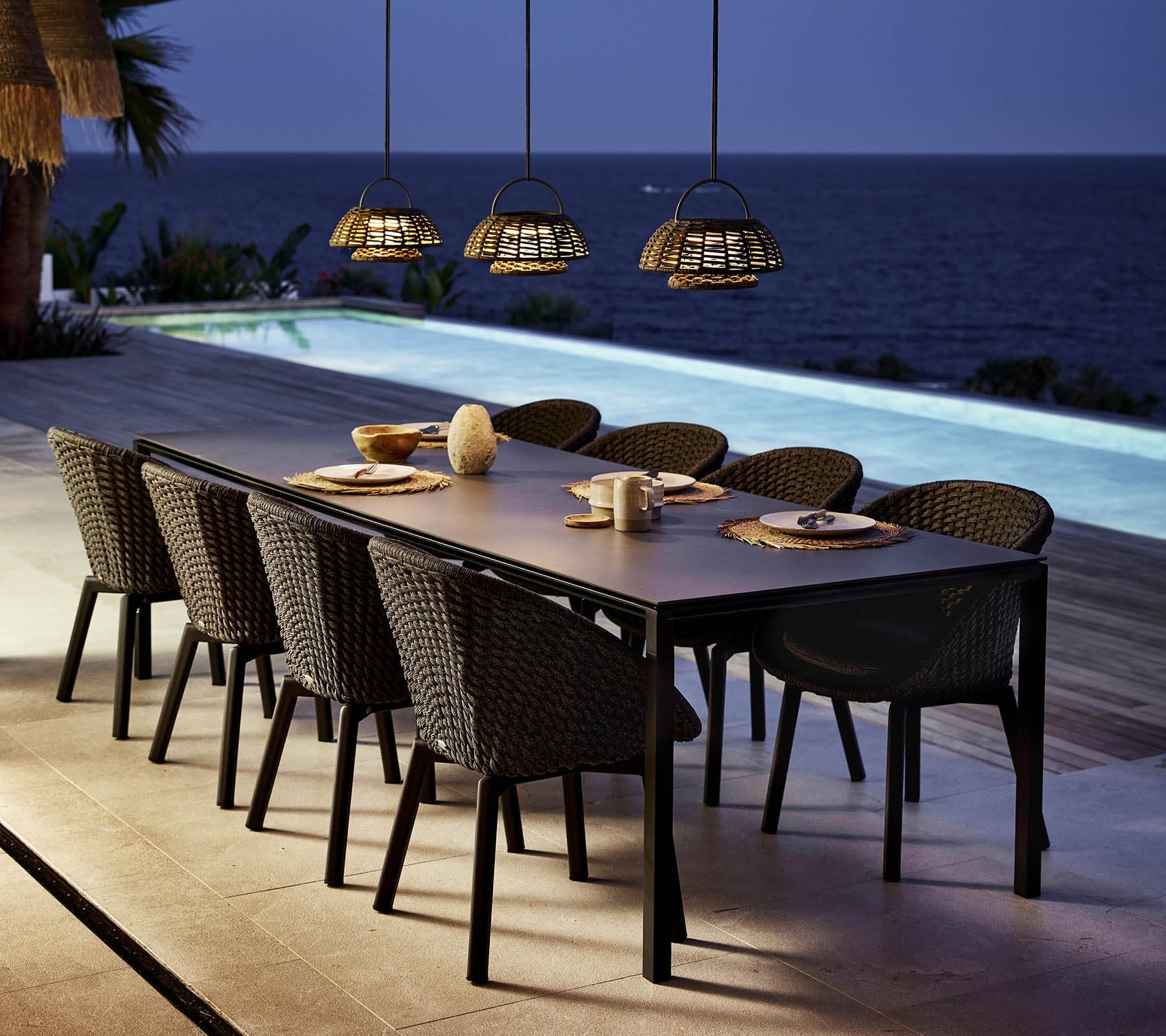Boxhill's Illusion Outdoor Hanging Lamp w/ Stand and Led Lamp lifestyle image with dining table and dining chairs near poolside