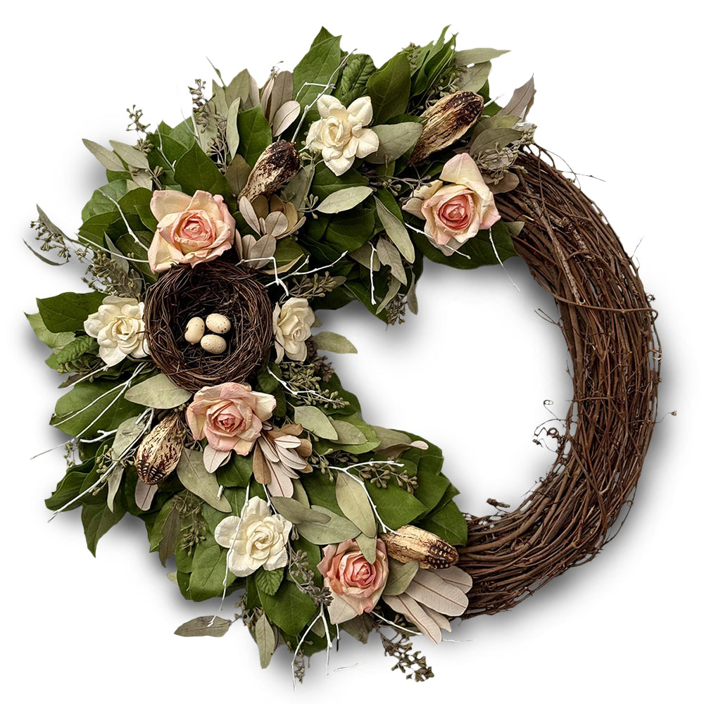 Festive spring wreath with natural leaves, twigs and petal accents