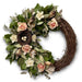 Festive spring wreath with natural leaves, twigs and petal accents