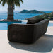 Boxhill's Savannah black outdoor sectional sofa with black cushion placed beside the pool