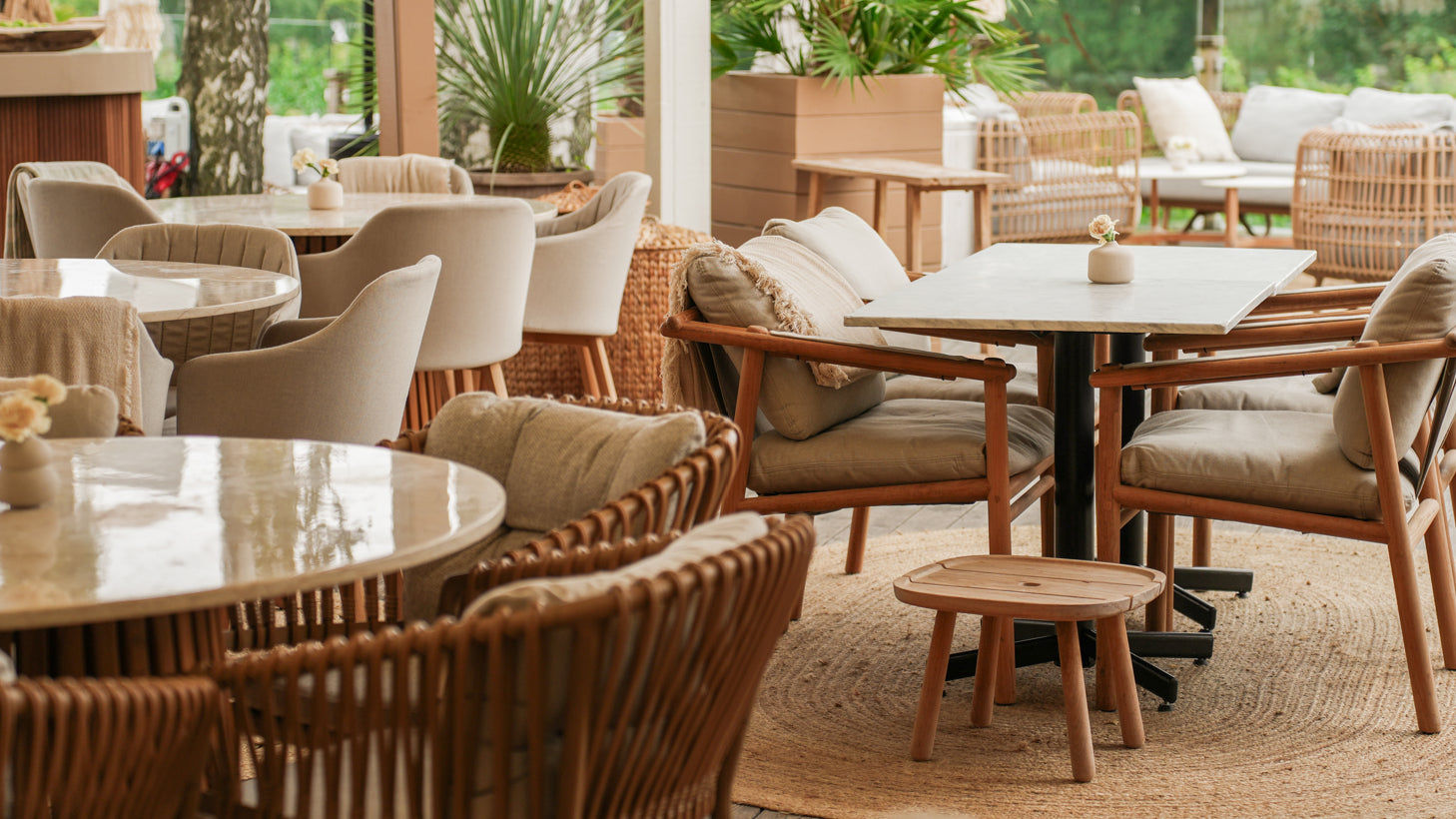 Commercial-Grade outdoor dining furniture with teak frames and quick-dry upholstery.