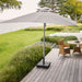  Boxhill's Shadow light grey parasol with pulley system | 3x3 m on wooden platform with teak round table and 3 brown chair