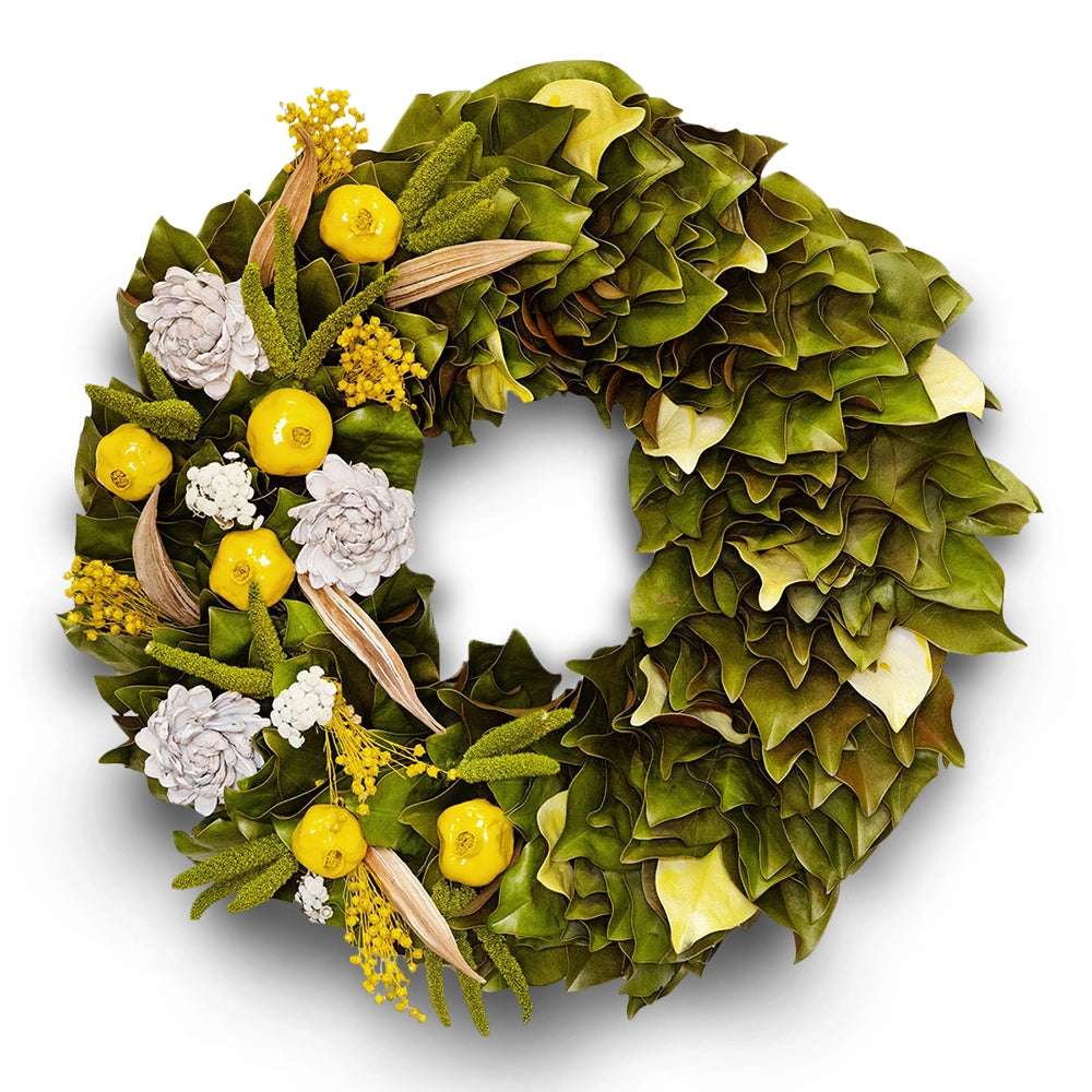 Decorative wreath with natural and magnolia leaf accents in yellow green hues