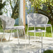  Boxhill's Twist white outdoor round coffee table with  2 white outdoor chair  placed in patio