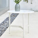  Boxhill's Twist white outdoor round coffee table with plants in a grey vase on it