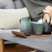 Boxhill's Twist dark grey rectangular outdoor coffee table with pots and cups on it
