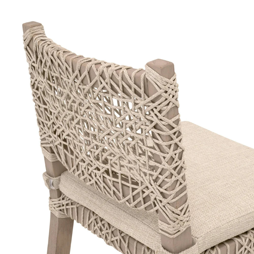 Beige wicker chair with woven backrest on a white background