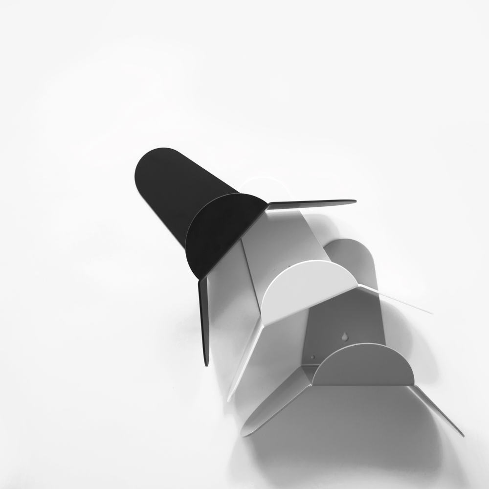 Close-up of a hose holder reel in black, white, and silver on a white background