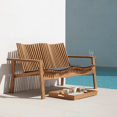 Boxhill's Amaze Chair Cushion Natte Grey on Amaze 2-Seater Sofa beside the pool