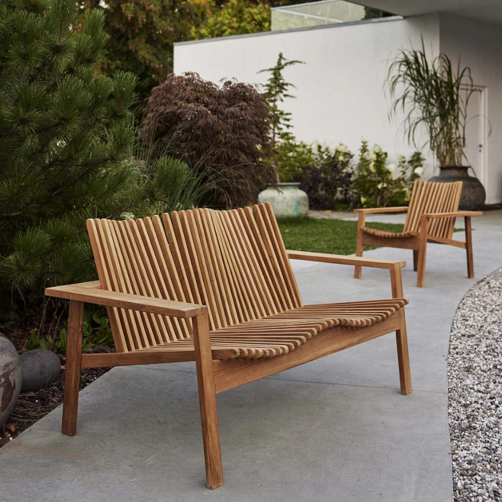 Boxhill's Amaze 2-Seater Teak Sofa lifestyle image with Amaze lounge chair