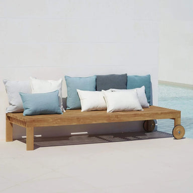 Boxhill's Amaze Chaise Lounge lifestyle image beside the pool with pillows on top