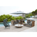 Boxhill's Arch 2-Seater Outdoor Sofa | High Arm/Back lifestyle image beside the pool  with man and woman sitting down 